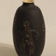 Ceramic vase decorated with women and a tree.