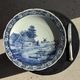 Vintage hollow circular plate in blue and white Boch pottery.