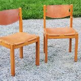Pair of brutalist chairs in elm and stretched leather with saddle stitching Self publisher