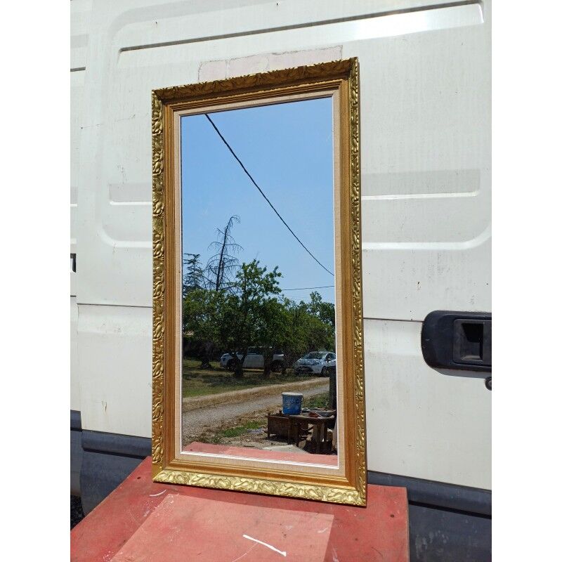 Wooden mirror and gold trim