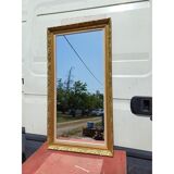 Wooden mirror and gold trim