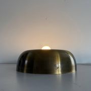 Flush-mounted disc-shaped brass fixture from the mid-century, 1960, Italy.