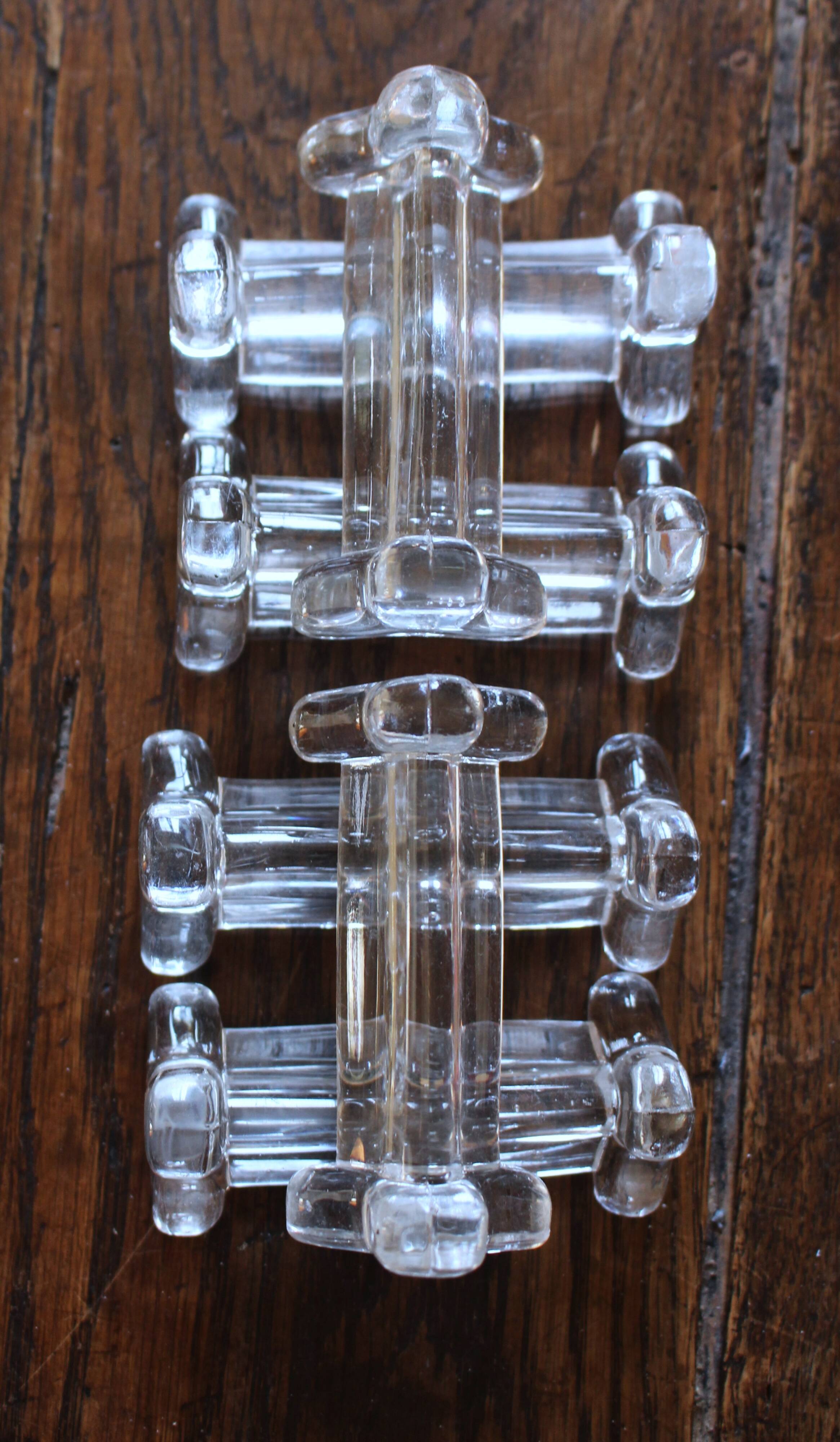 A set of 6 transparent trilobite glass knife rests.