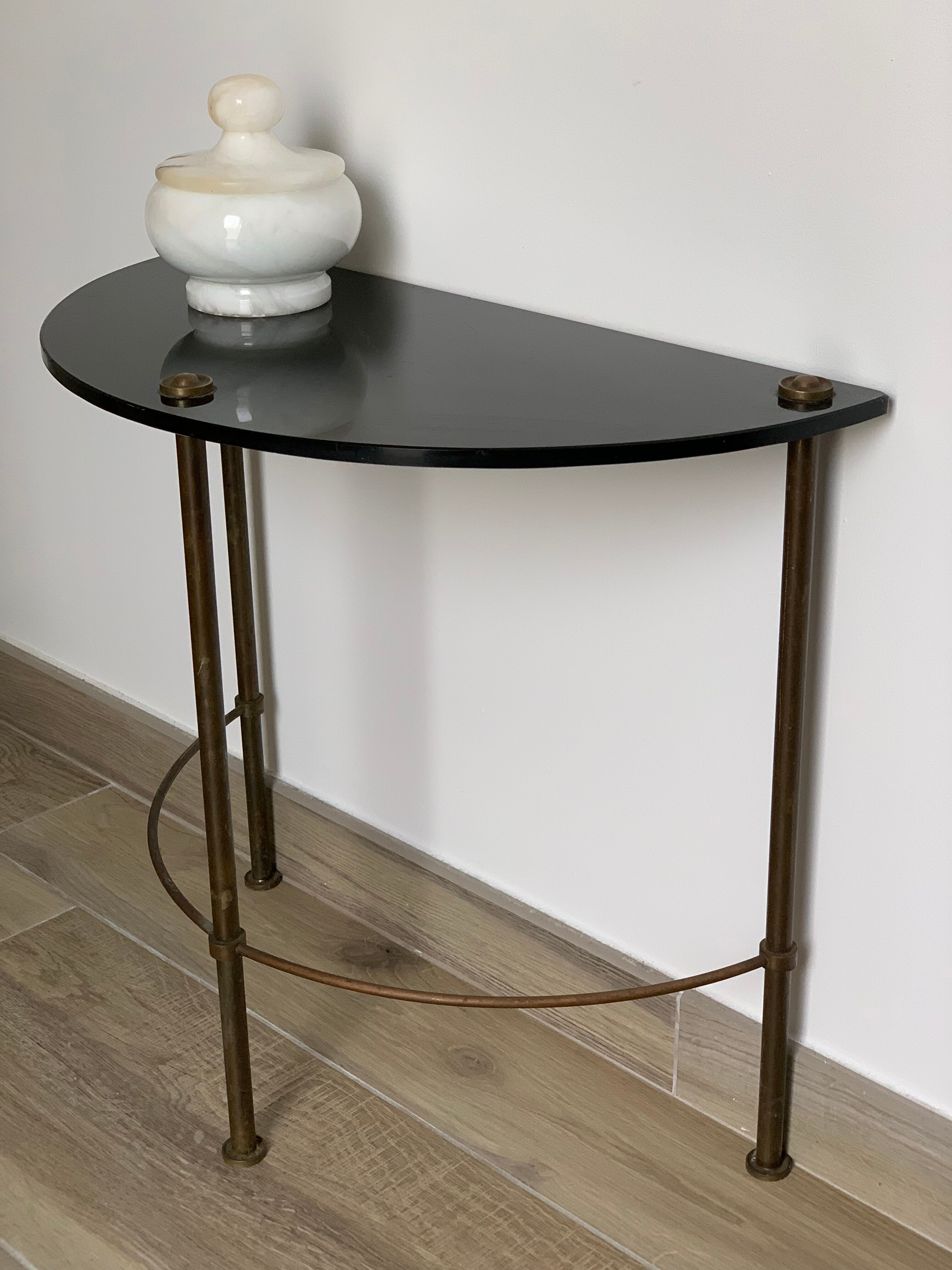 Half-moon console in glass and brass