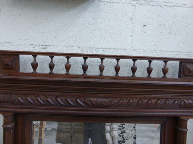 Large mirror beveled Henri II style varnished and carved wooden 128 x 92 cm