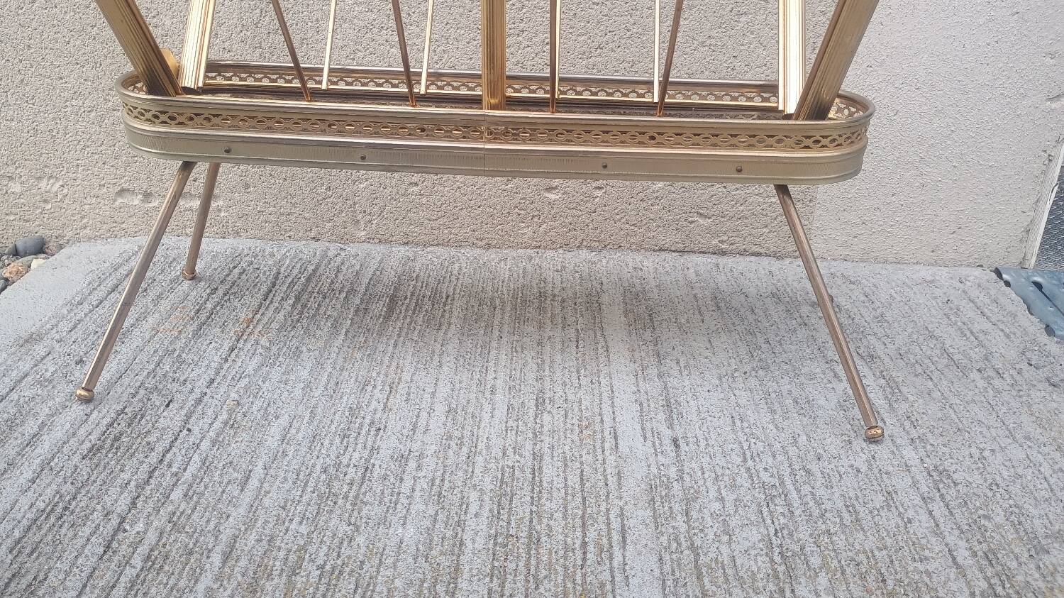 1960s brass folding magazine rack with lacquered wood decoration.