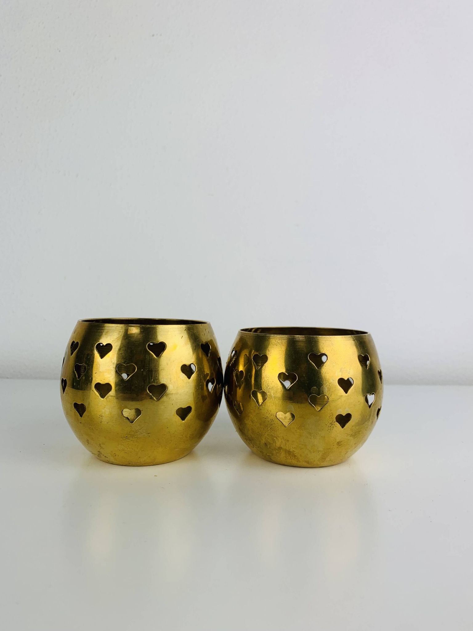 Pair of vintage openwork brass candle holders/votive candlesticks, gilded