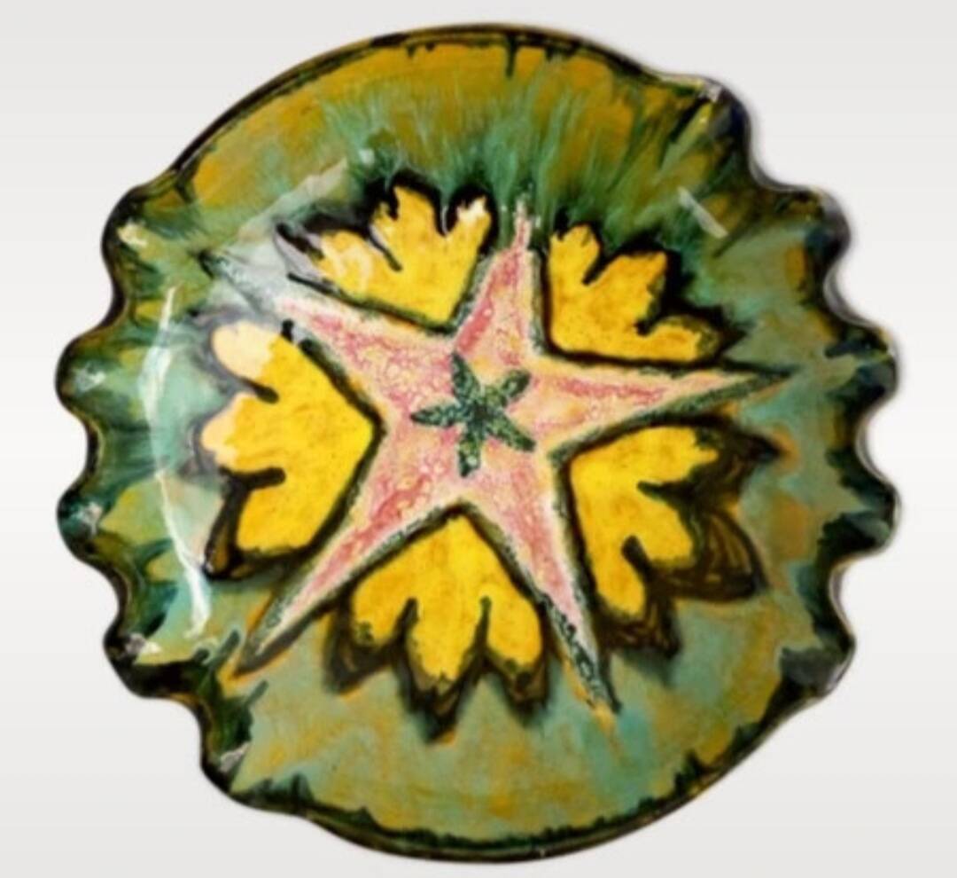 Multicolored earthenware dish signed Yvon Roy