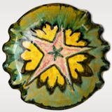 Multicolored earthenware dish signed Yvon Roy