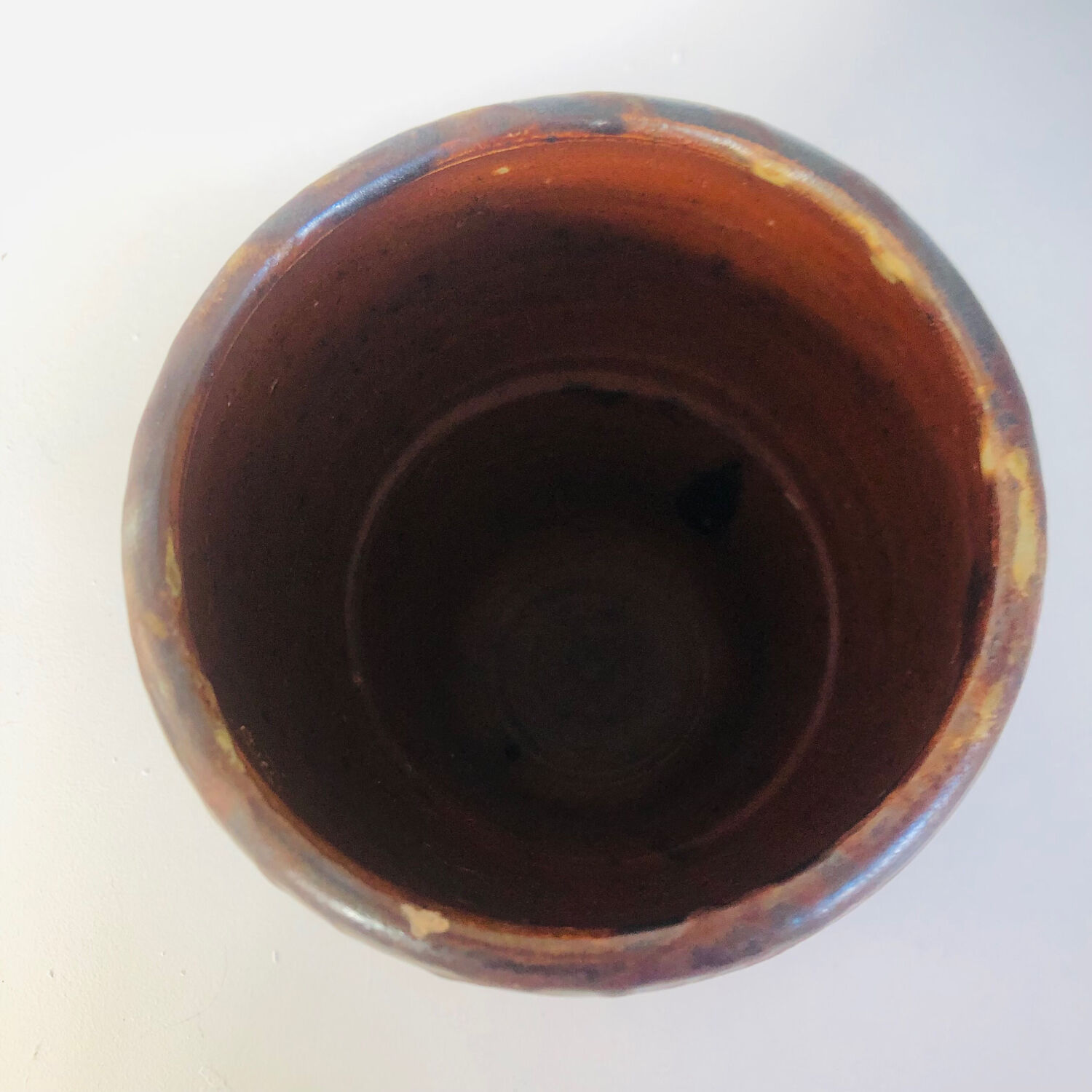 Metallic brown ceramic torso vase