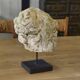 Reconstituted stone sculpture in antique style from the 20th century.
