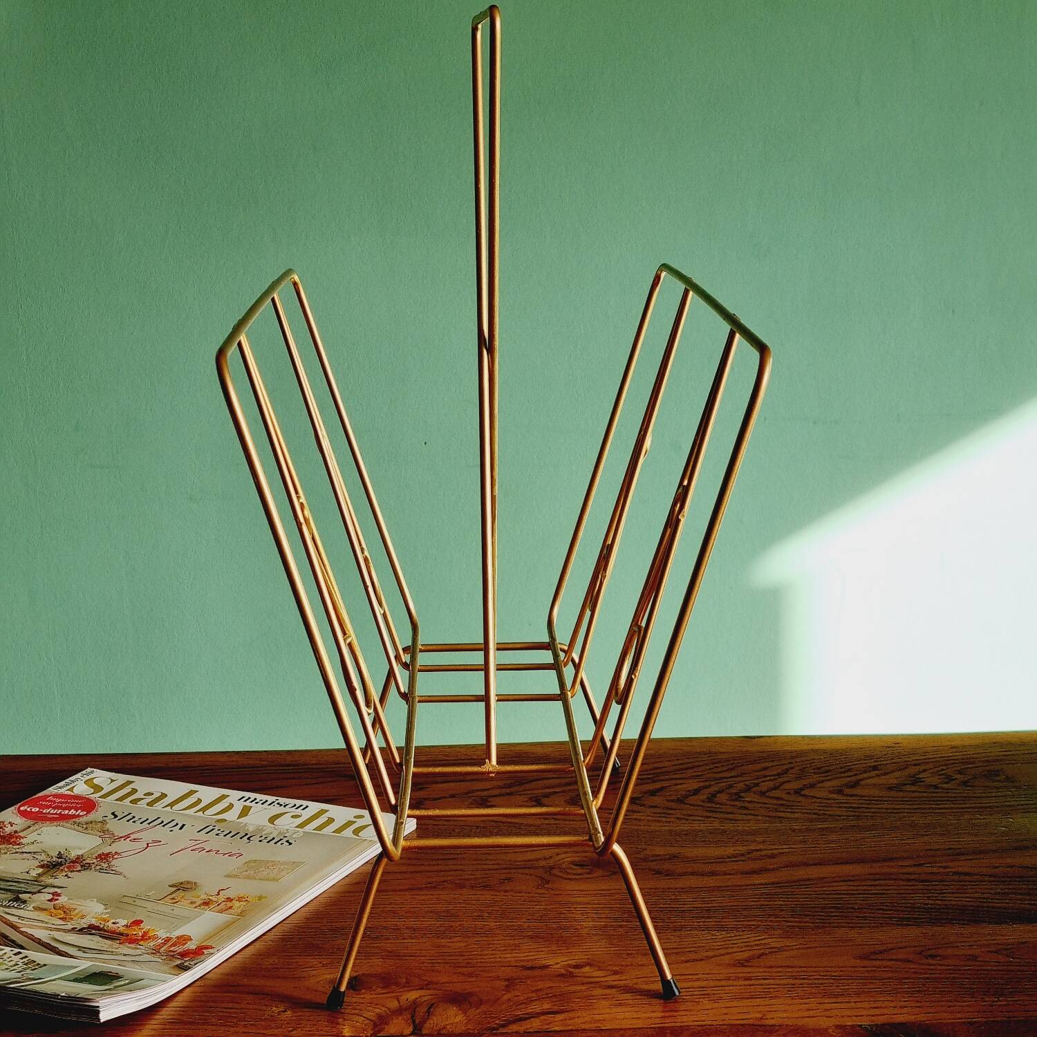 Golden metal magazine holder