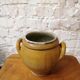 Old yellow glazed terracotta pot