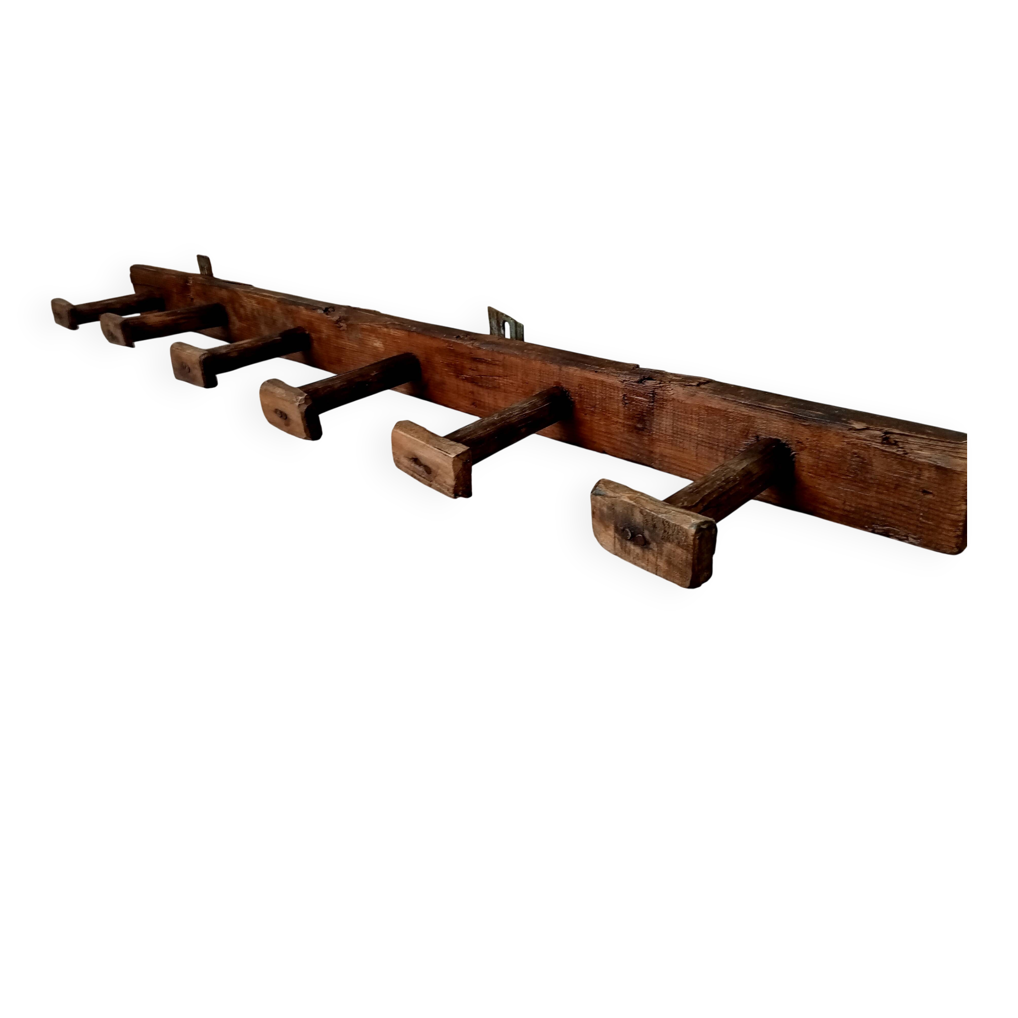 Old wall-mounted coat rack from a stable, folk art.