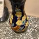 Small vase with floral patterns in the style of Longwy.