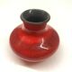 Red ceramic ball vase signed A