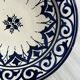Raised dish, ceramic plate with blue and white patterns.