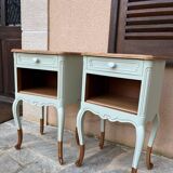 Renovated bedside tables in laurel green and light wood.