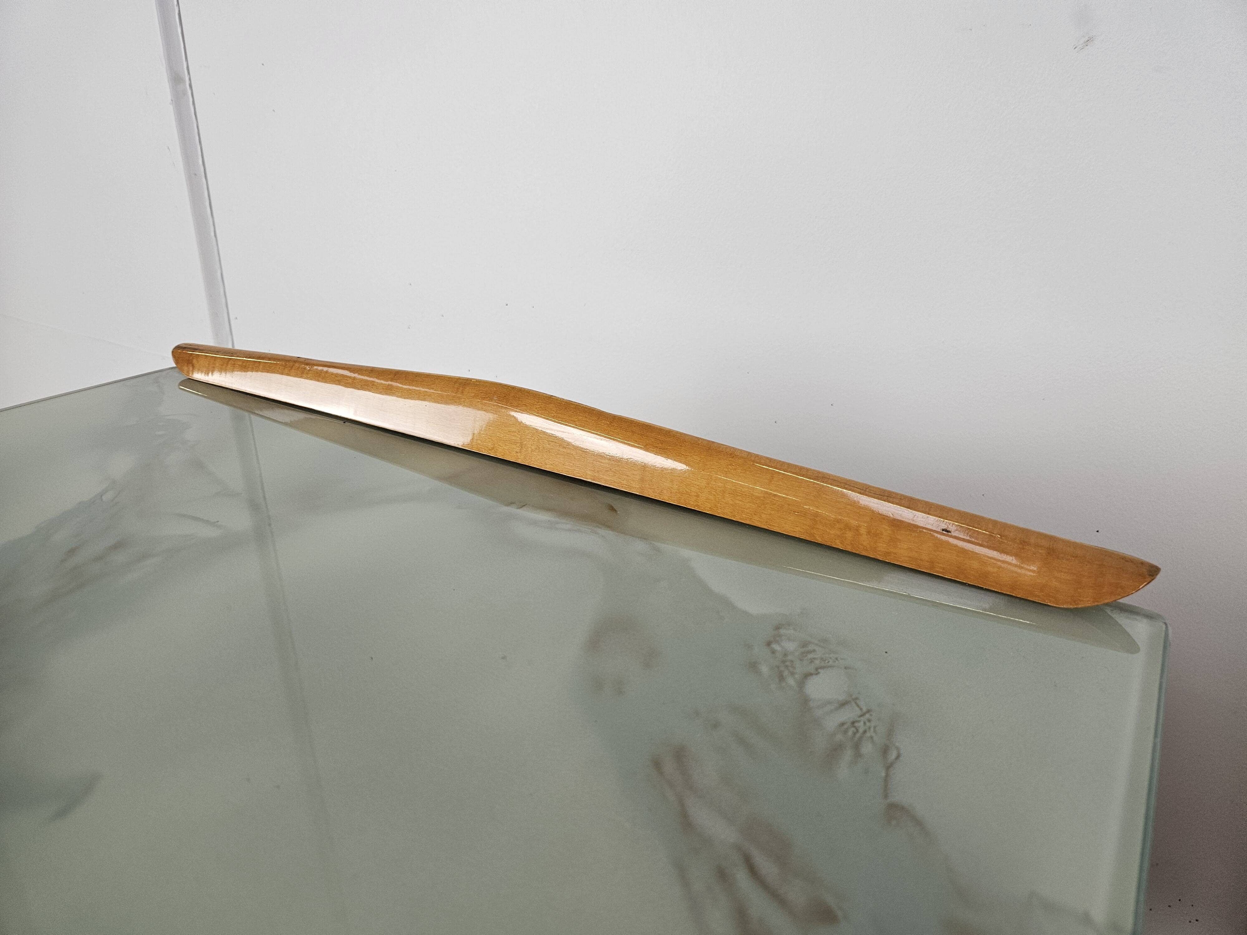 Mid-century nightstands in maple, brass, and glass