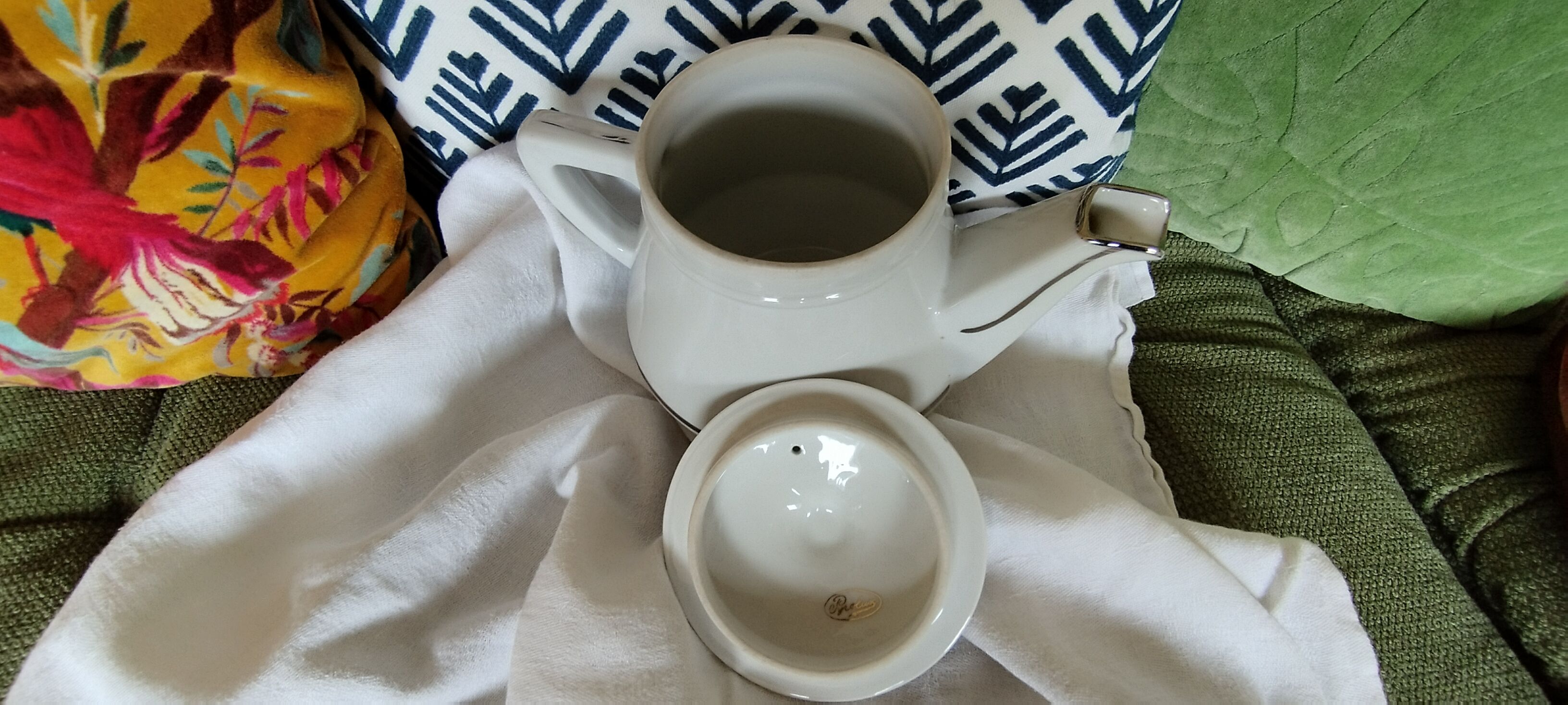 White and silver porcelain teapot