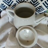 White and silver porcelain teapot