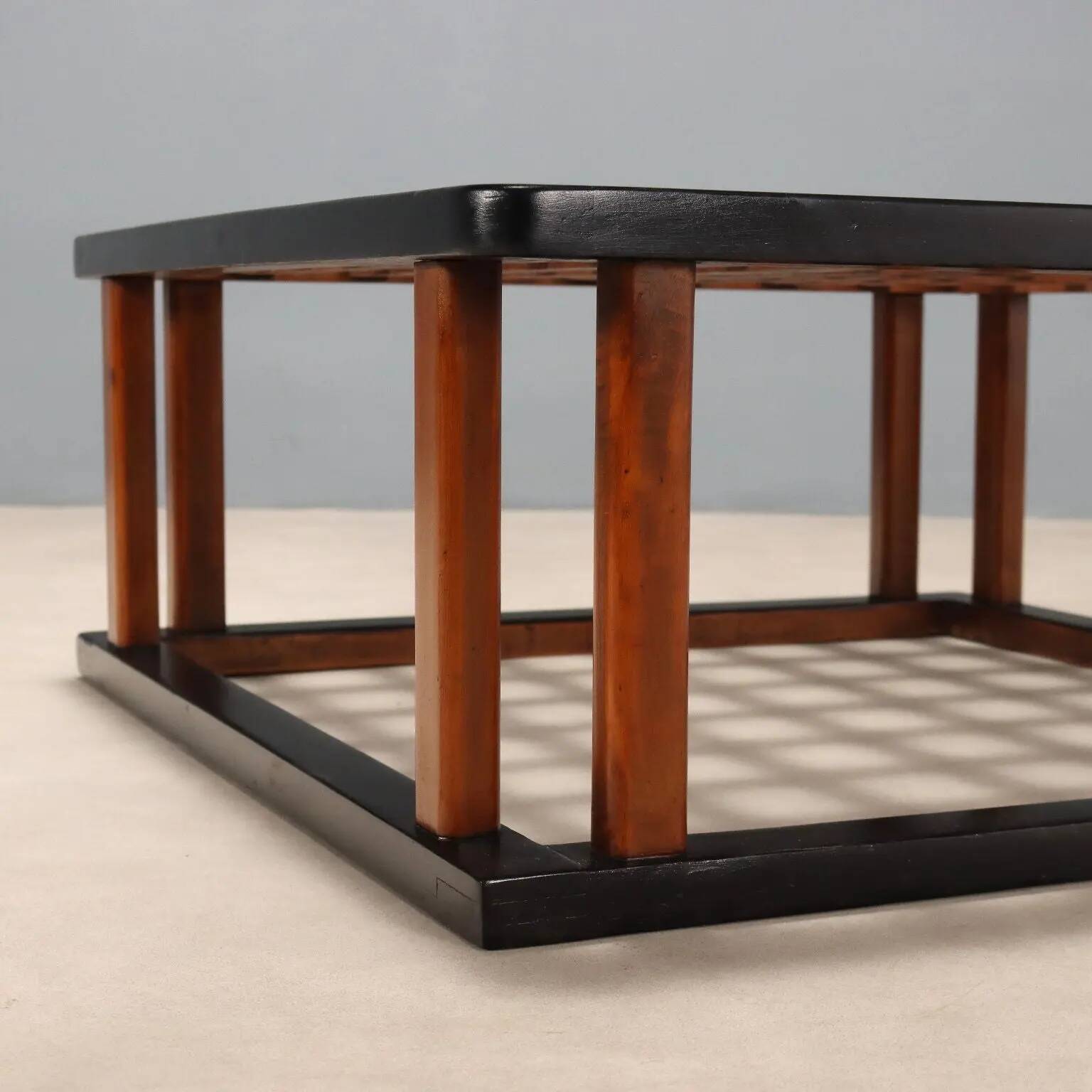 Vintage wooden coffee table with paint and glass, design from the 1940s-50s.