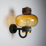 Pair of brass wall lamps with decorated amber coloured shades