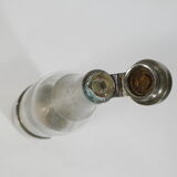 Bottle in glass and metal