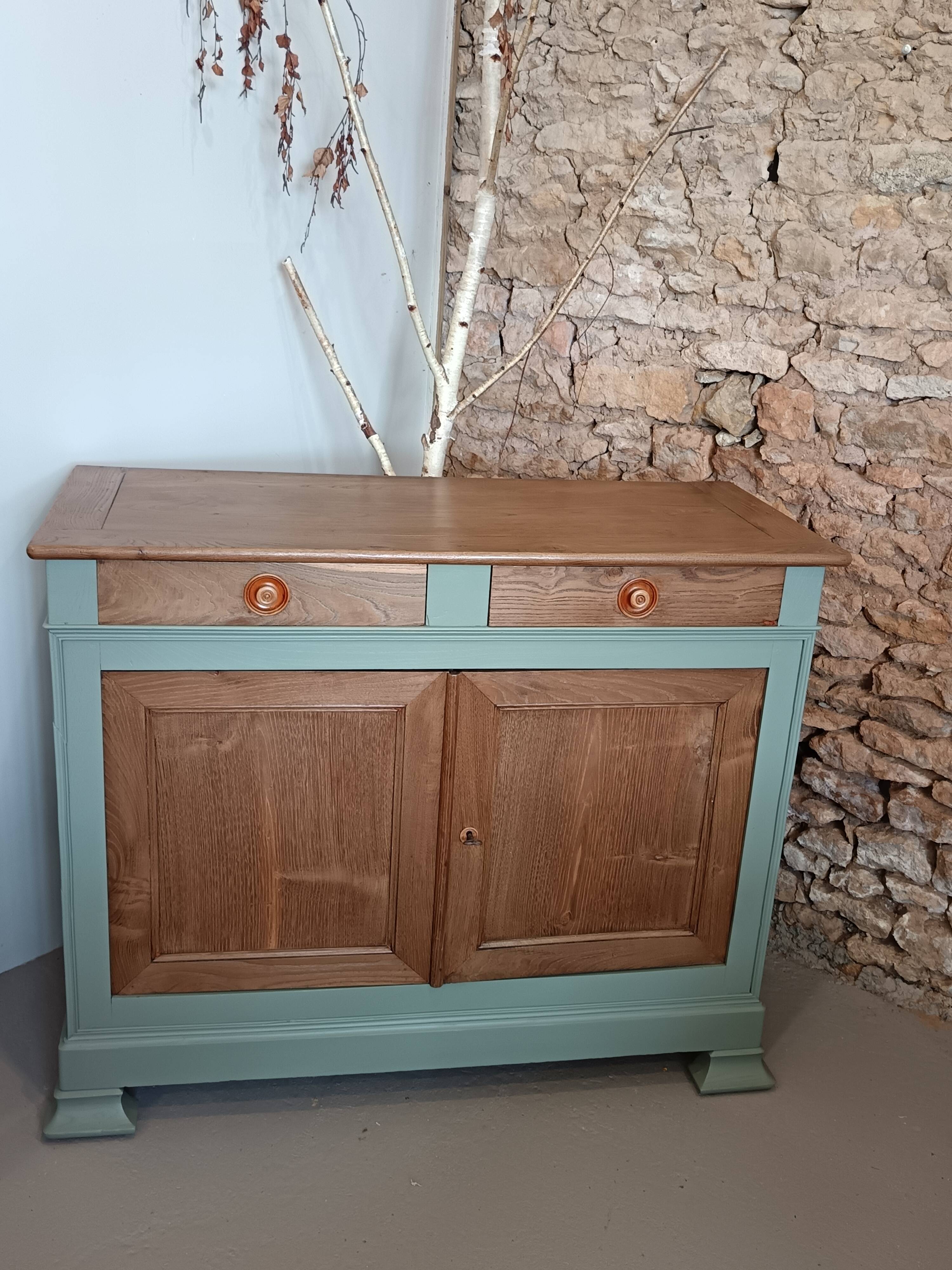 Buffet made of natural wood and bronze green.