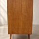 Vintage 1960s commode with tapered legs.