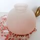 Pink glass wall lamp with garland of pearls