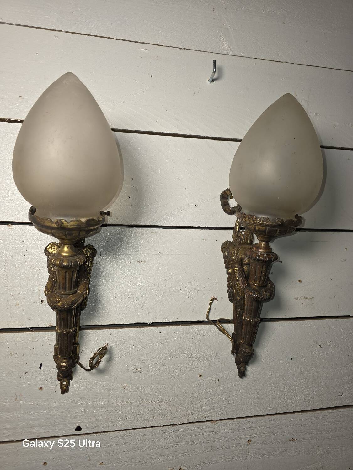 Pair of torch wall lights in Louis XVI style in 19th-century bronze.