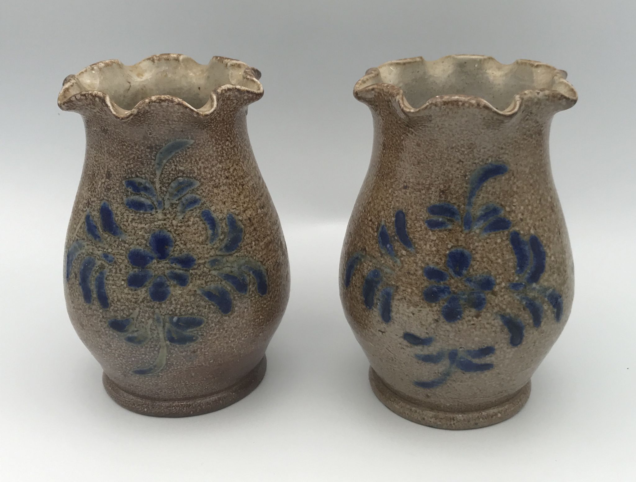 Pair of vintage pottery vases with floral decoration and glaçureau sel