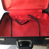 Black soft suitcase with buckle on top