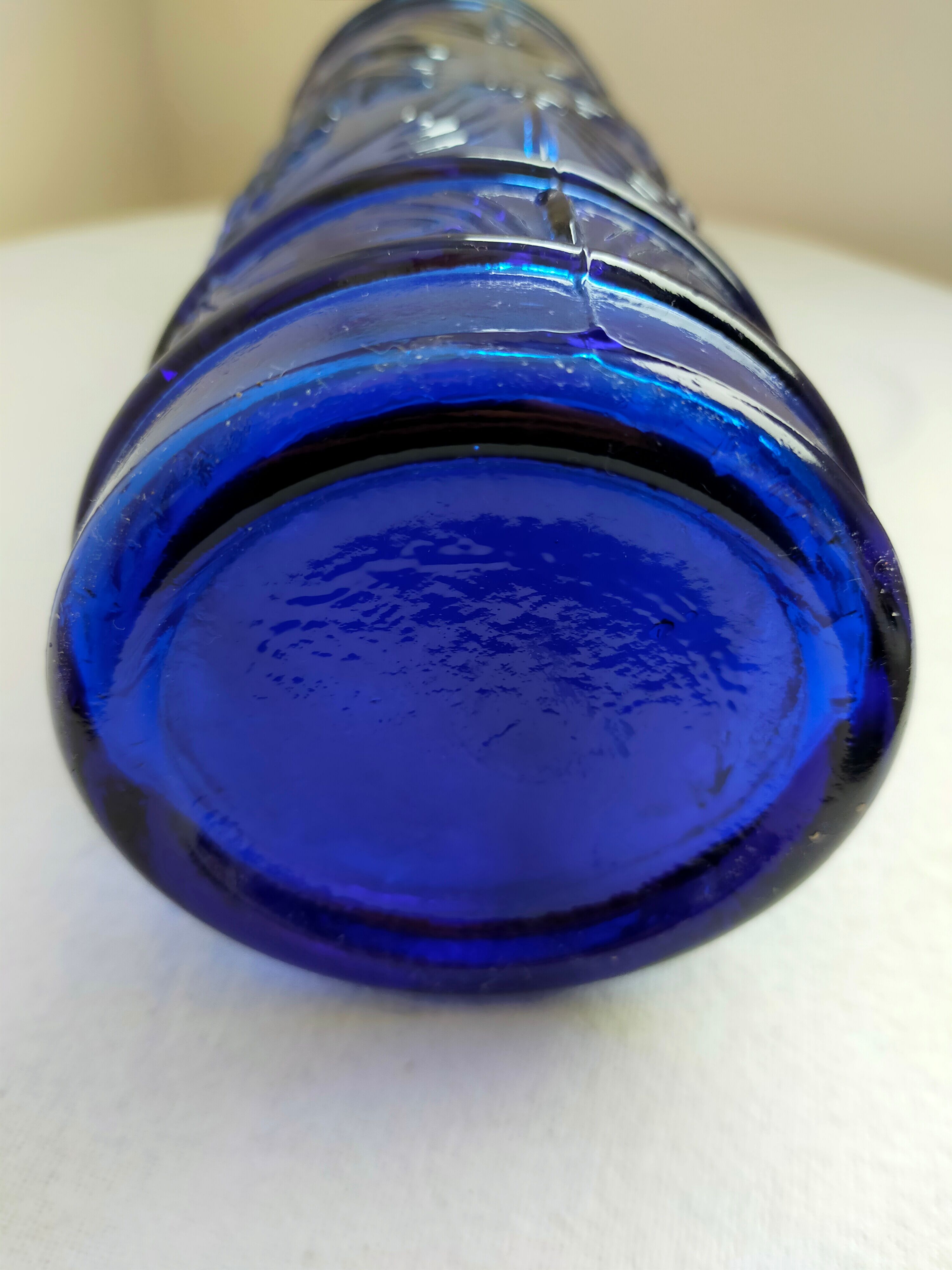 cobalt blue molded glass bottle in relief decoration bunches of grapes