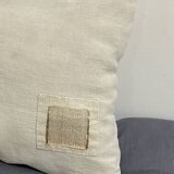 Cushion in vintage fabric with ornamentation