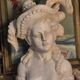 Bust of a woman with a hat