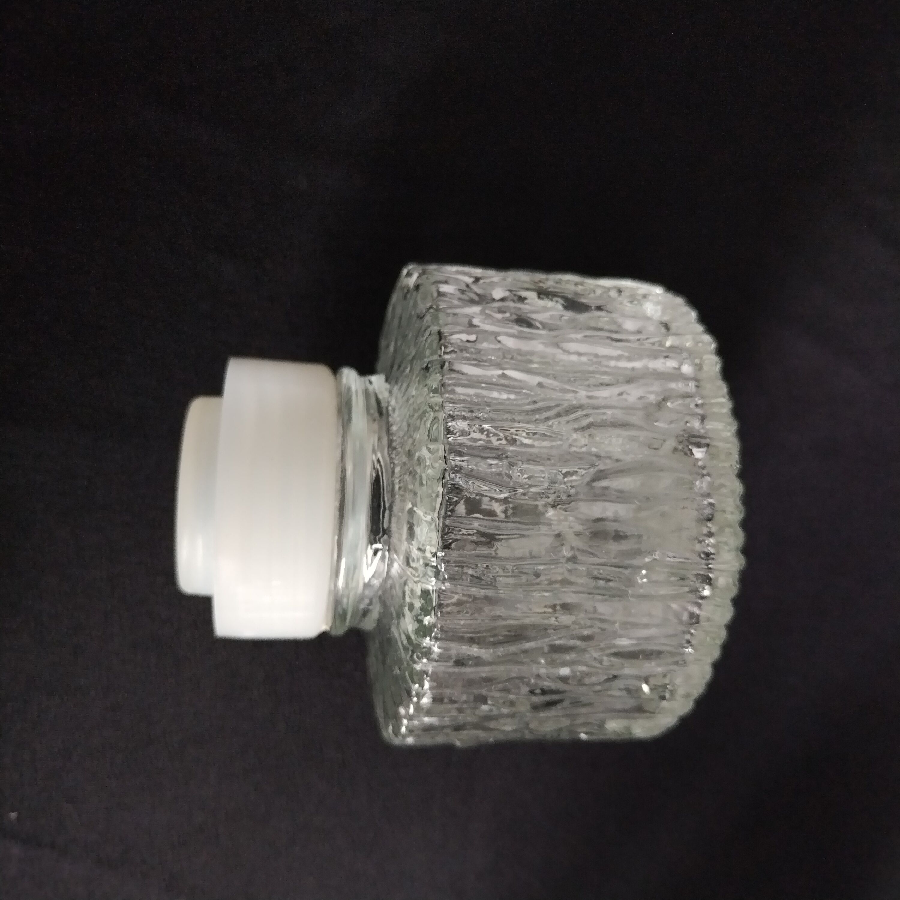 Transparent vintage carafe in pressed glass and its hermetic cap 70's