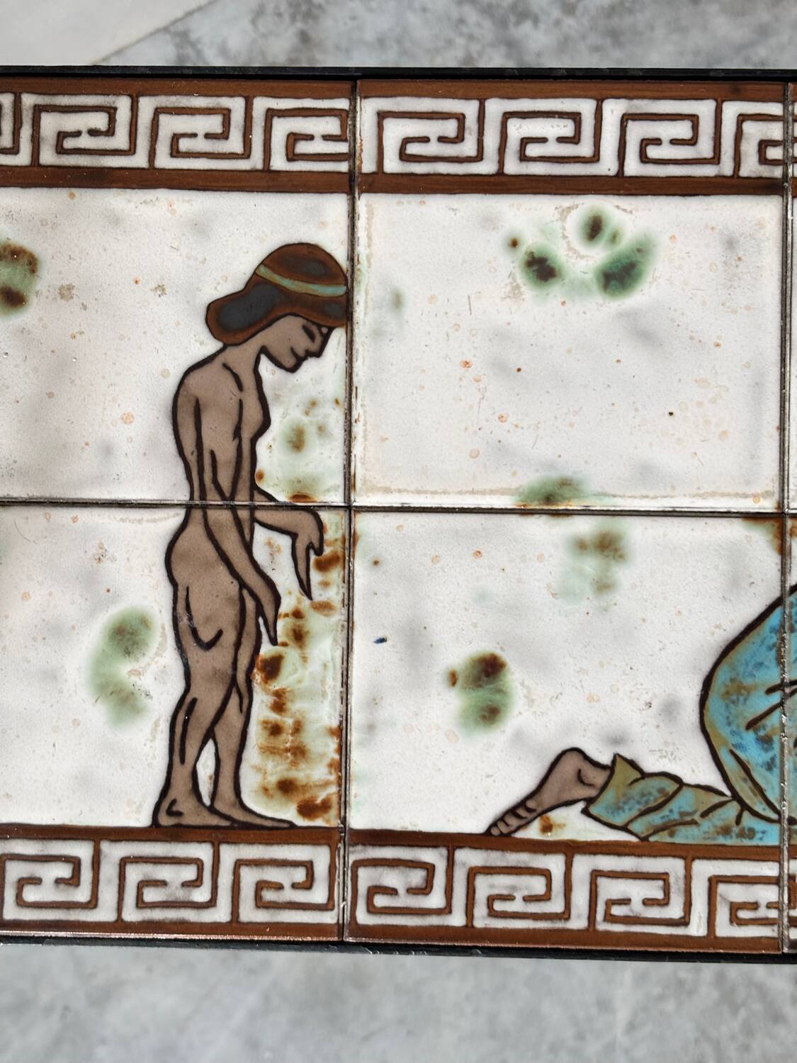 Vintage magazine table with Greek mythology motif.