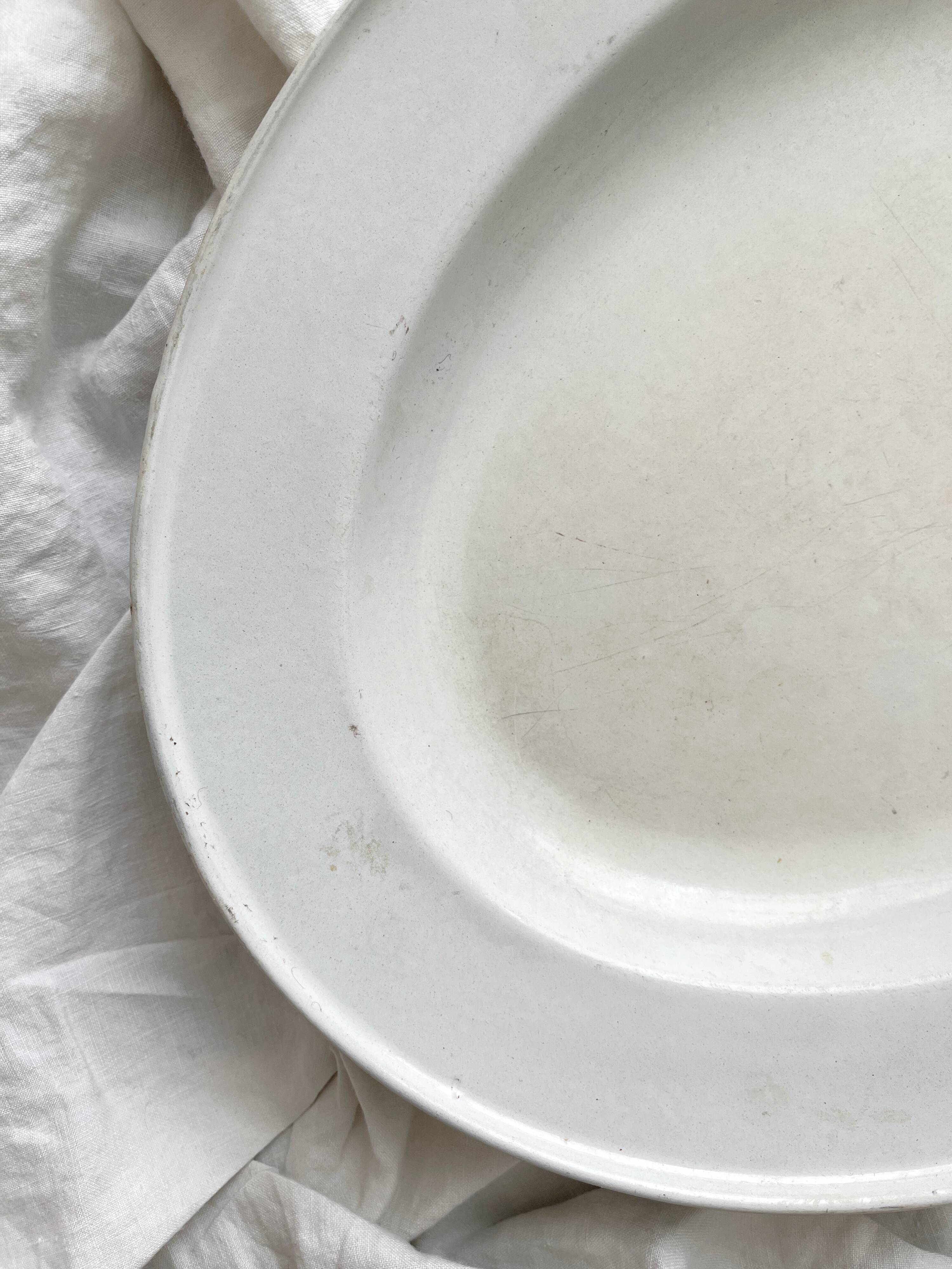 Vintage marbled white and blue enameled sheet metal oval dish