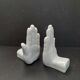 Ceramic bookends in the shape of hands.