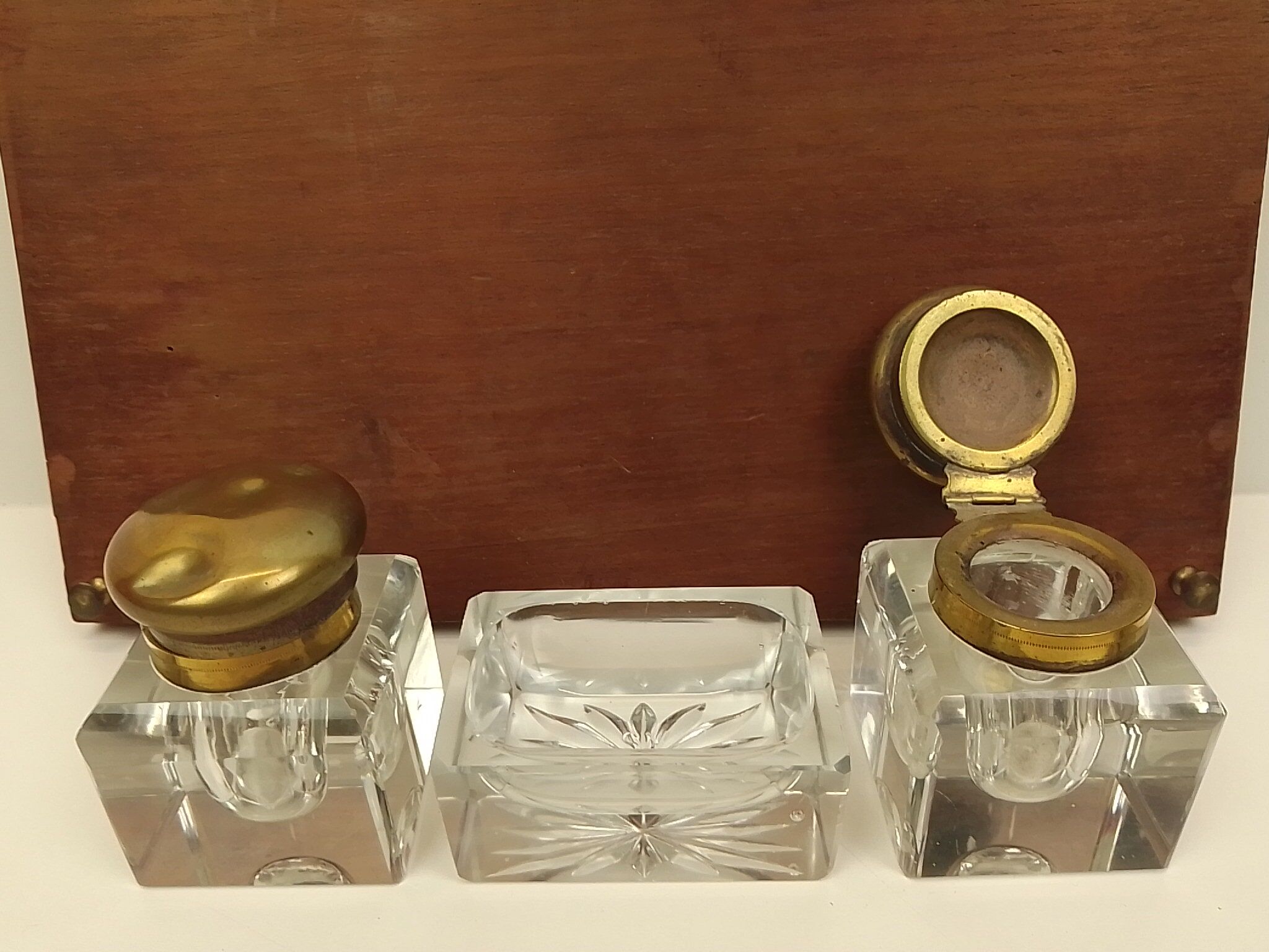 Old wooden office inkwell set and glass and brass accessories