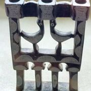 Three-branched stone candlestick adorned with birds, North Africa