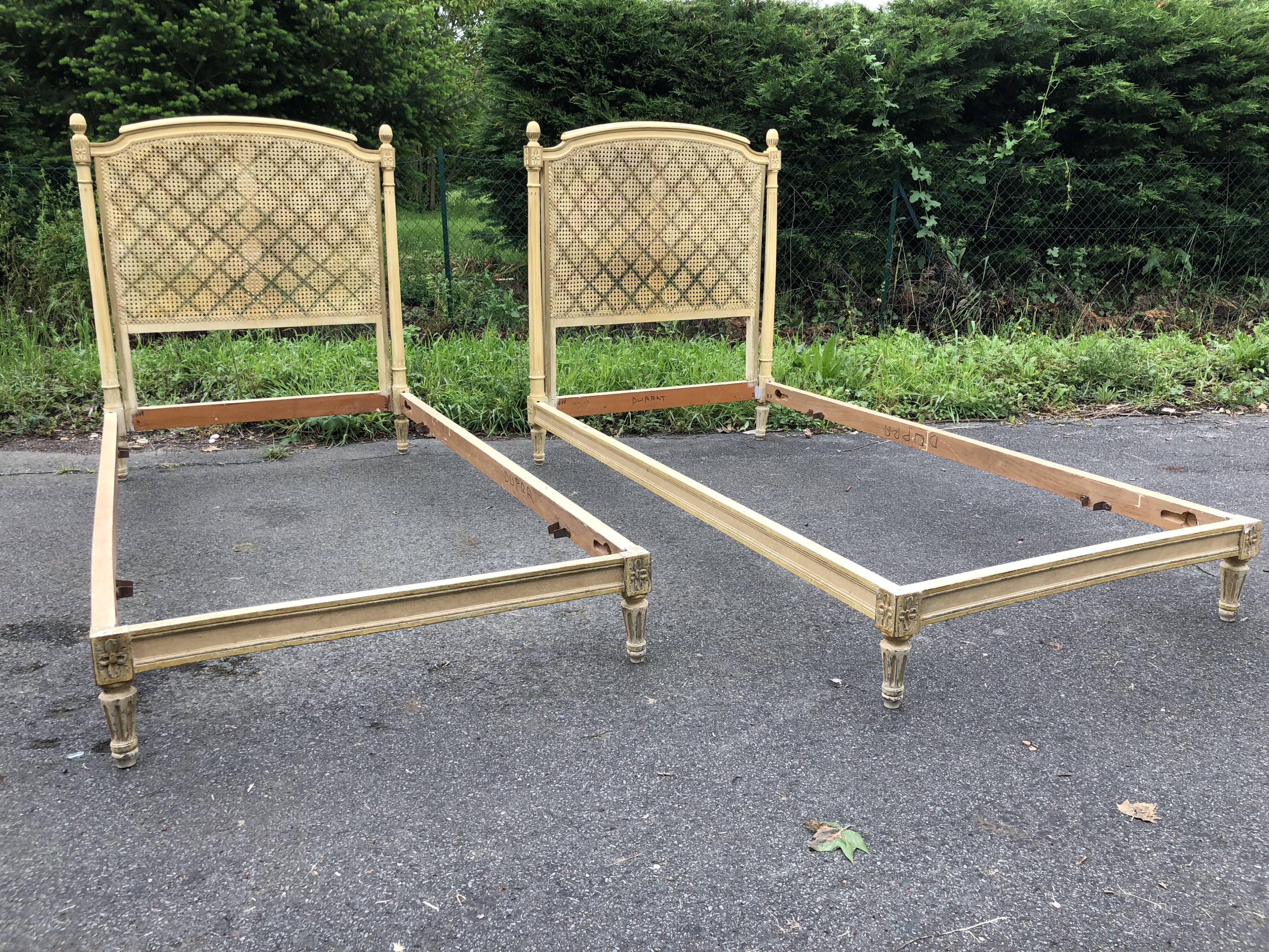 Pair of twin bed Louis XVI caned painted patinated