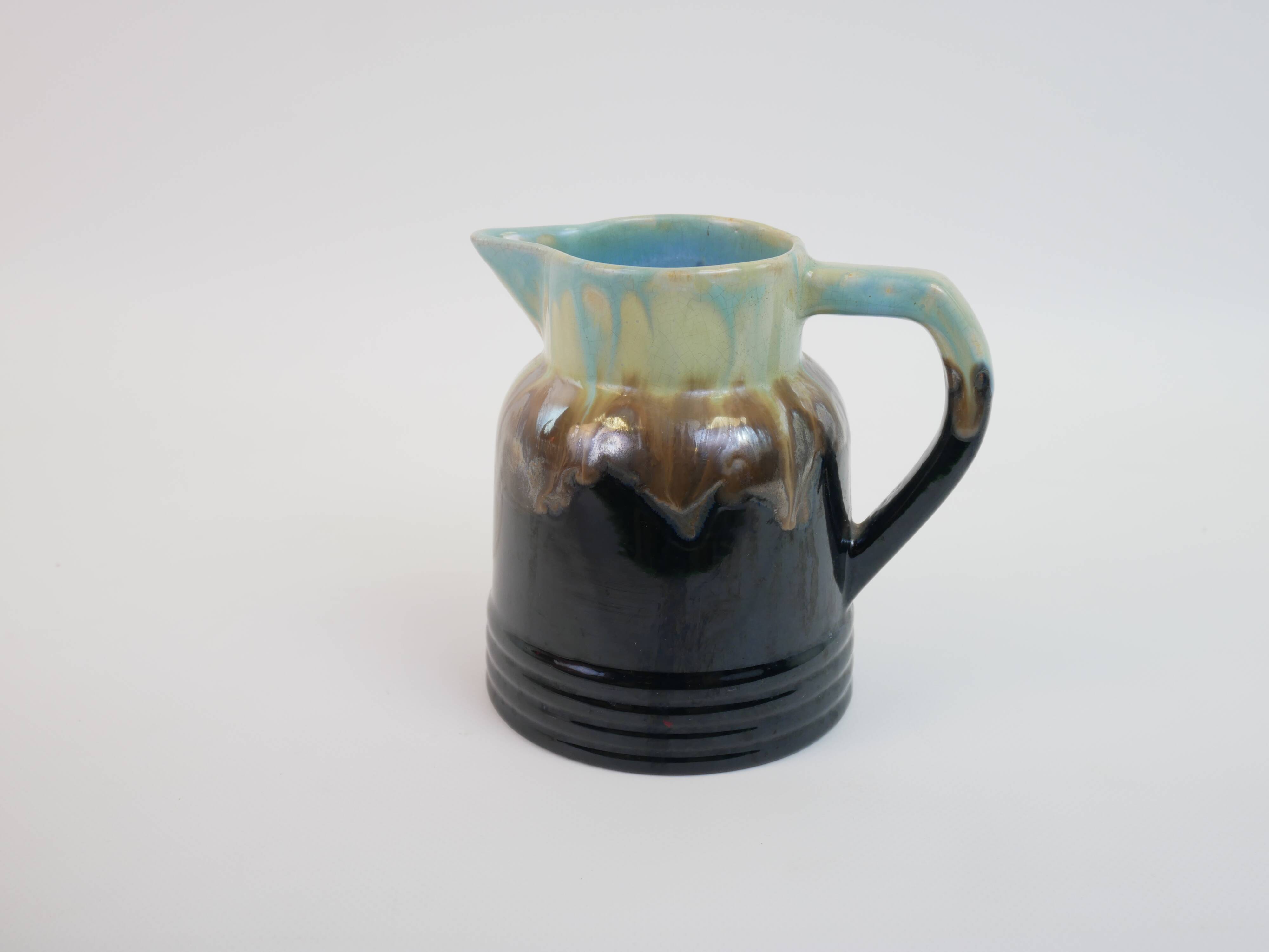 Art Deco pitcher in black, brown and blue glazed ceramic