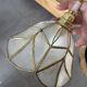 Italian lampshade applique from the 1970s in mother-of-pearl and gilded brass.