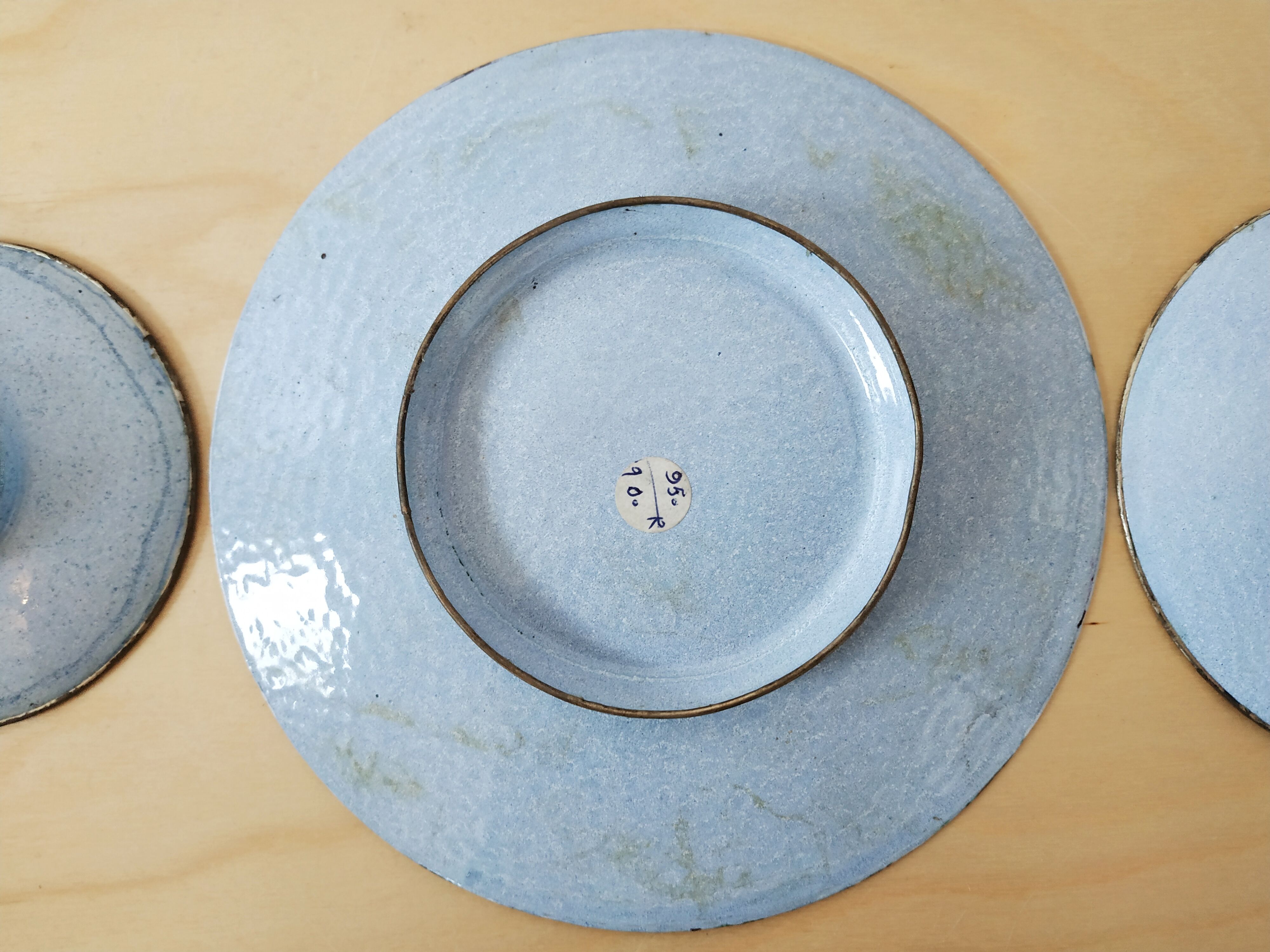 Plate and two decorative saucers enamelled with Persia decoration, circa 1940