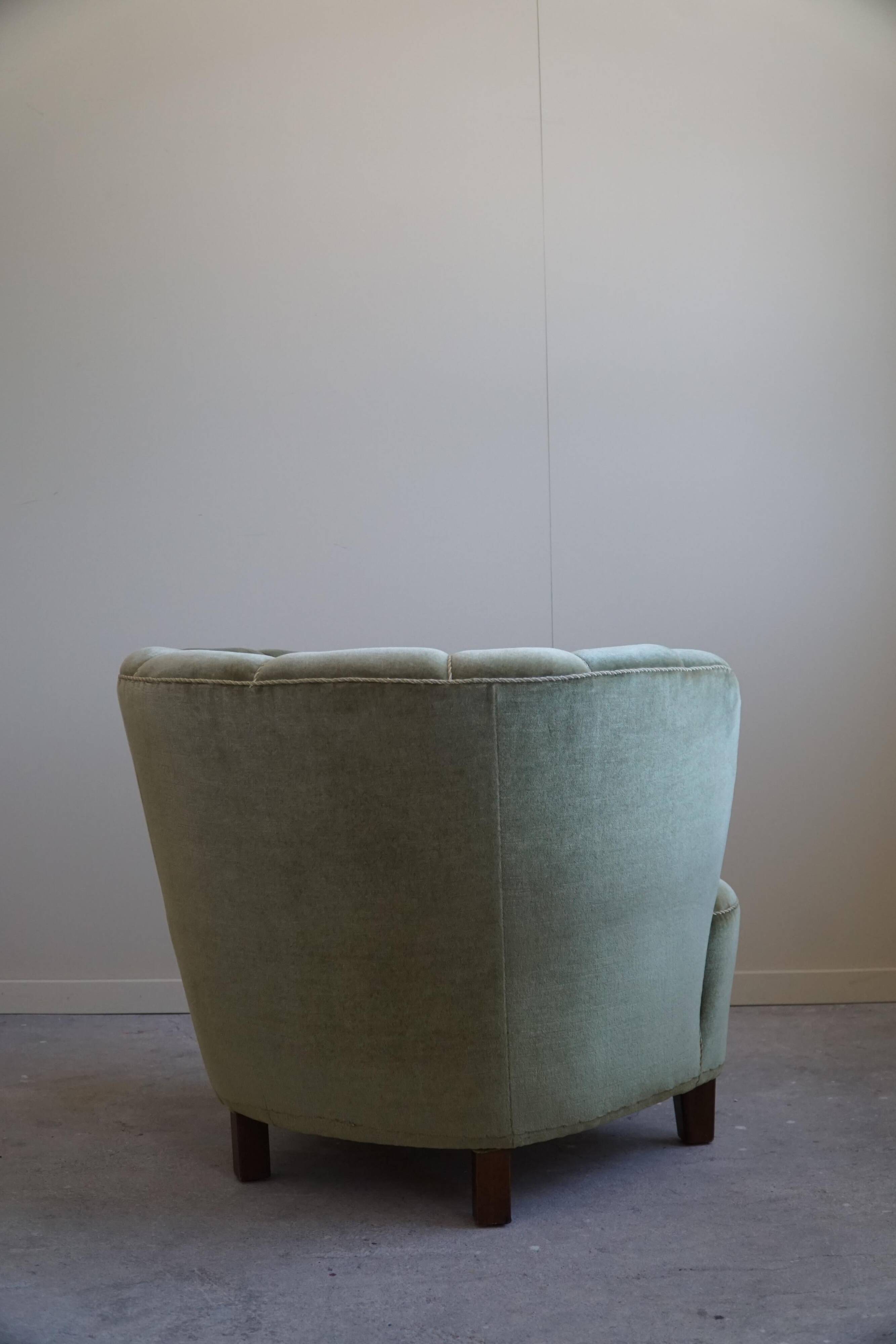 Curved Danish club chair from the mid-century, in the style of Viggo Boesen, 1940s.