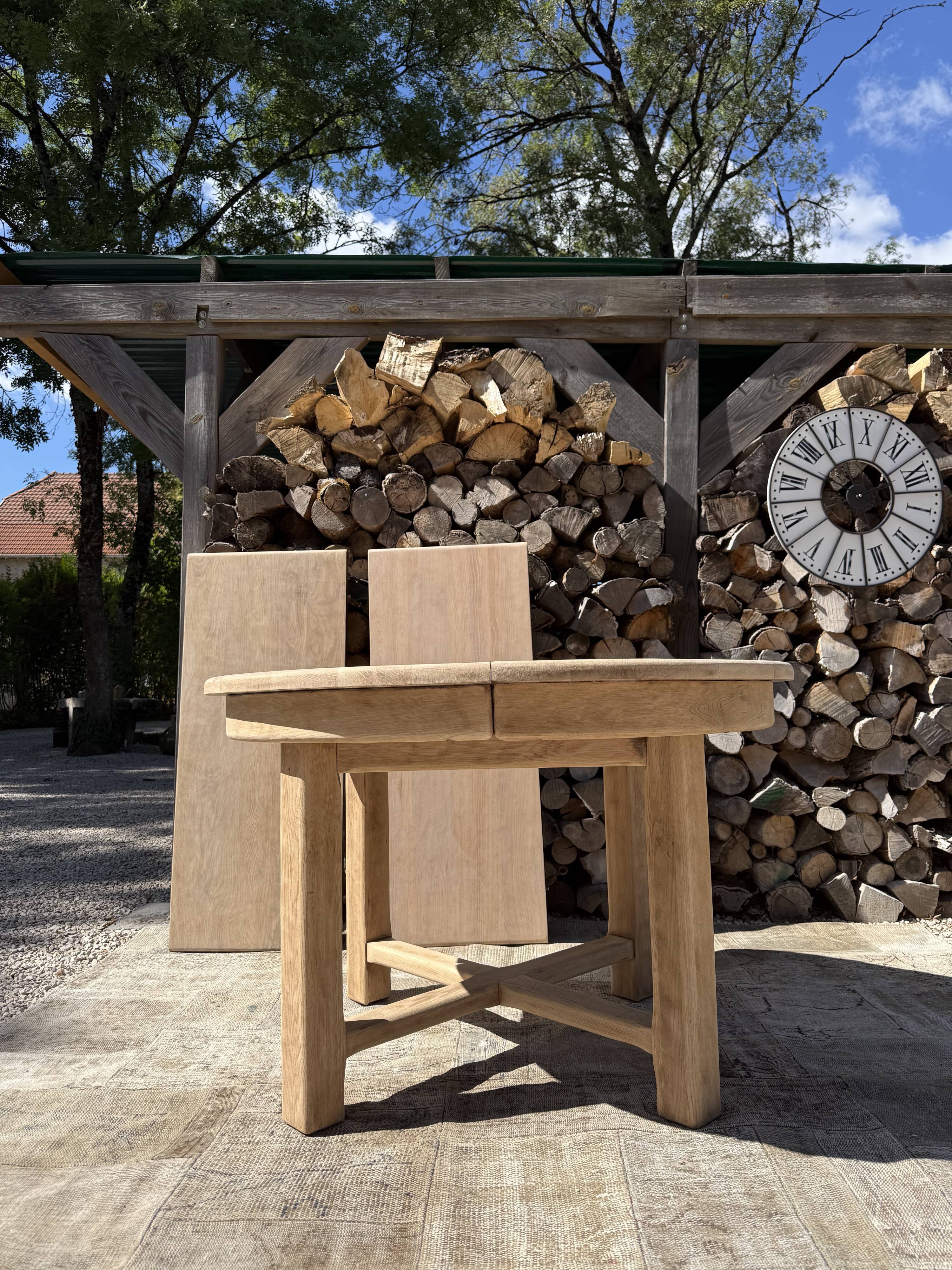 Round solid oak table with extensions, maximum 220cm.
