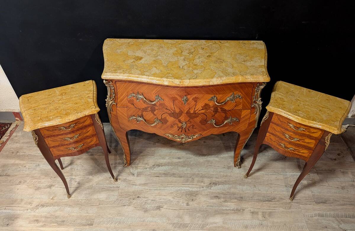 Louis XV style commode with marquetry and its pair of bedside tables.